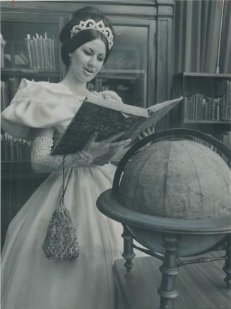 Beauty and the book. Dina Sibellino examines an old journal that is part of the Ontario Teachers' Federation Centennial Library at 1260 Bay Street. It was opened to the public last night