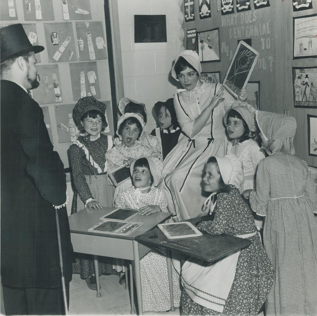 Old time school is re-enacted under the eye of teacher James Brooker as part of Dunlace Dr. Public School's centennial project. Proceeds of their play(...)