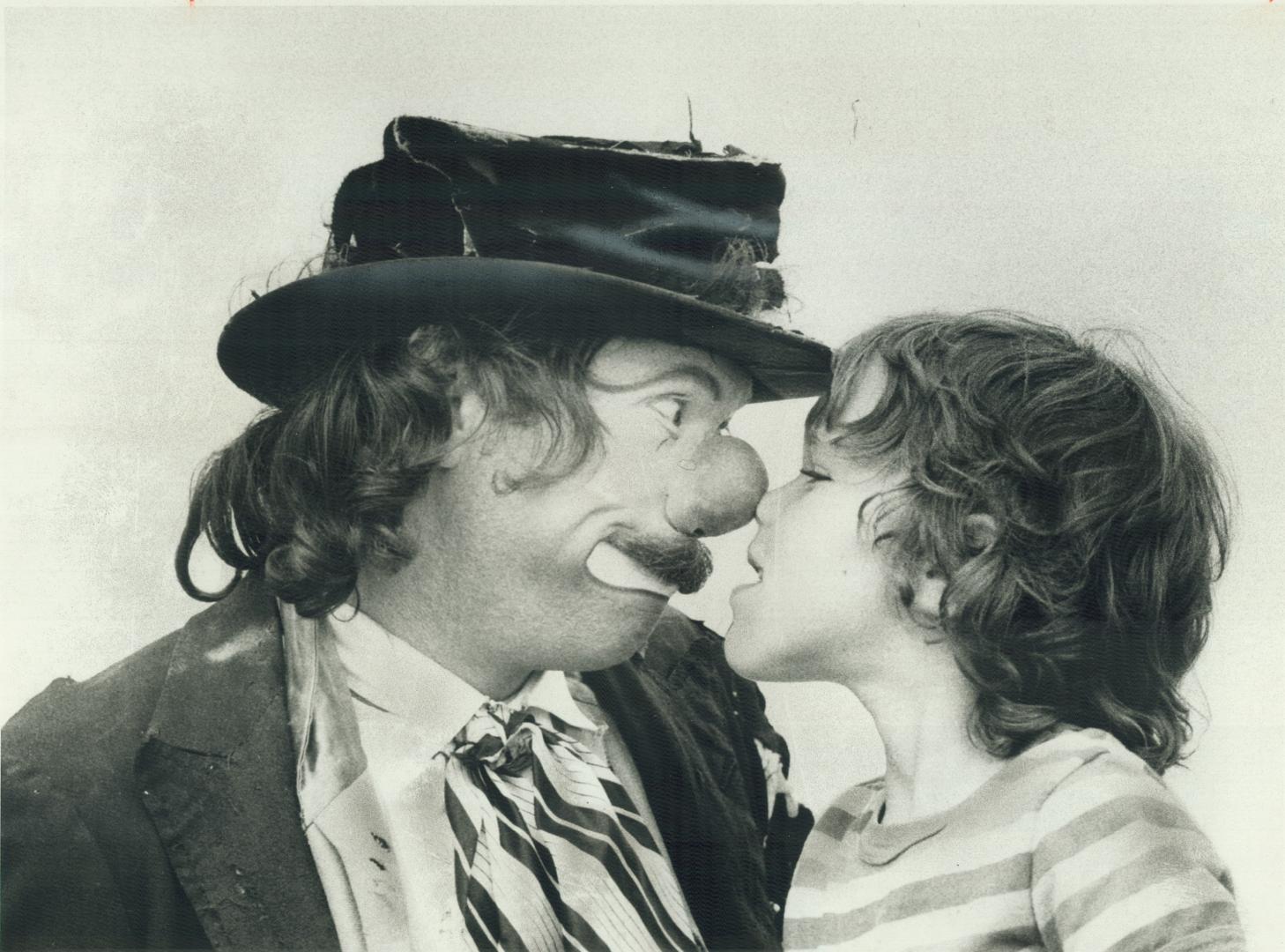 Clown Frazier Mohawk nose-to-nose with Caleb Rubin, 7, at Harbourfront's circus, Bathurst Quay