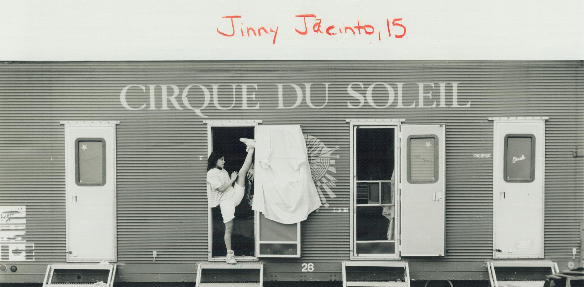 Jinny Jacinto, 15, limbers up in the doorway of the trailer she calls home