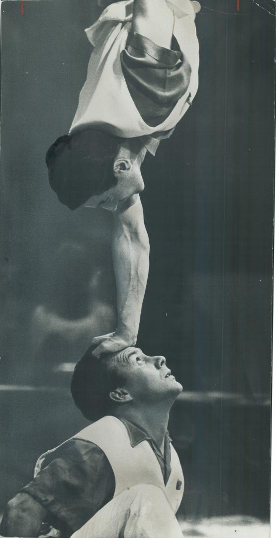 Handy fellows and heady, too, are strongmen Kaseyey and Manassarian doing balacing act with Great Moscow Circus at Maple Leaf Gardens