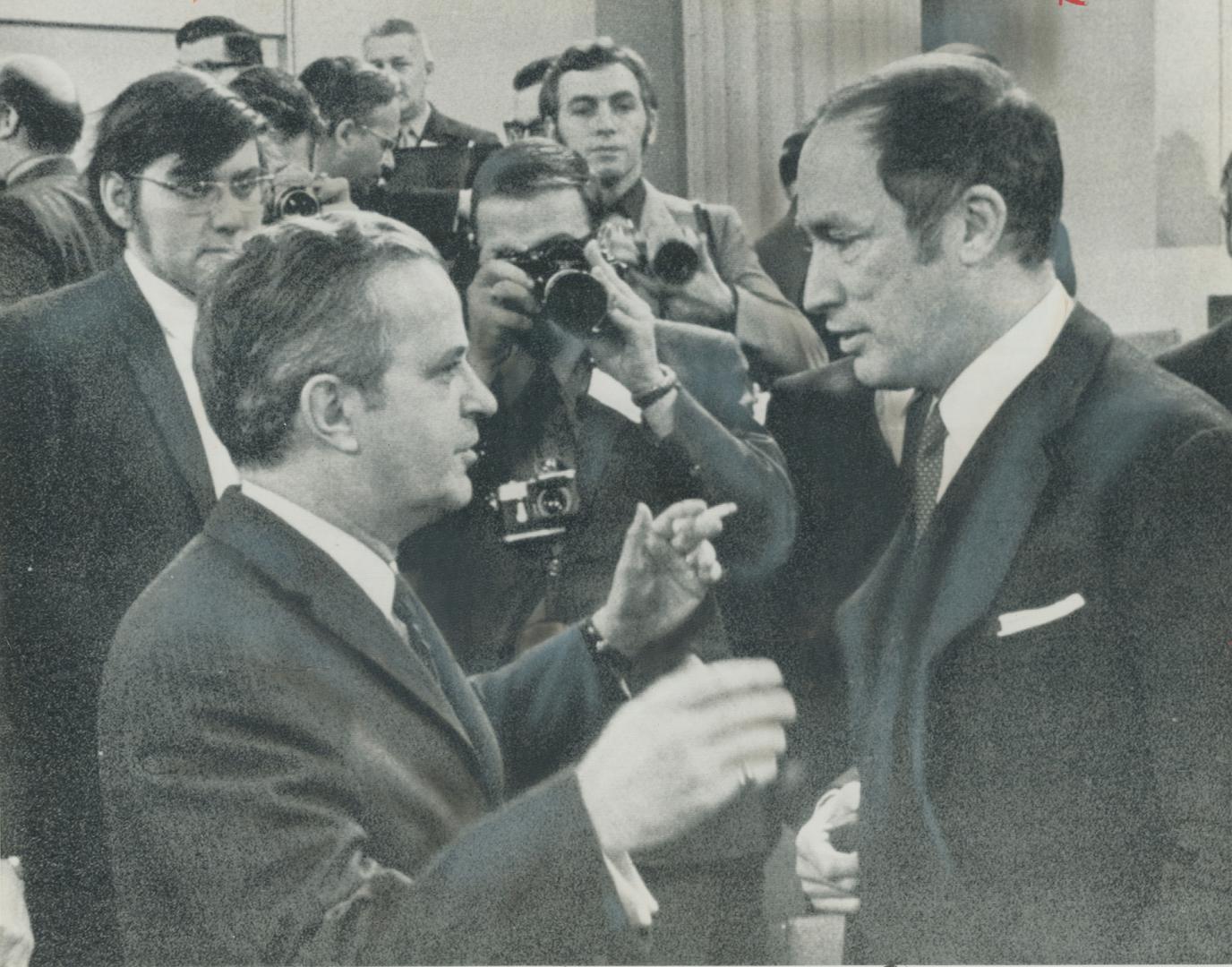 Prime Minister Pierre Trudeau, right, warmly welcomes Quebec Premier Jean-Jacques Bertrand to Ottawa's old Union Station today for talks on bread-and-(...)