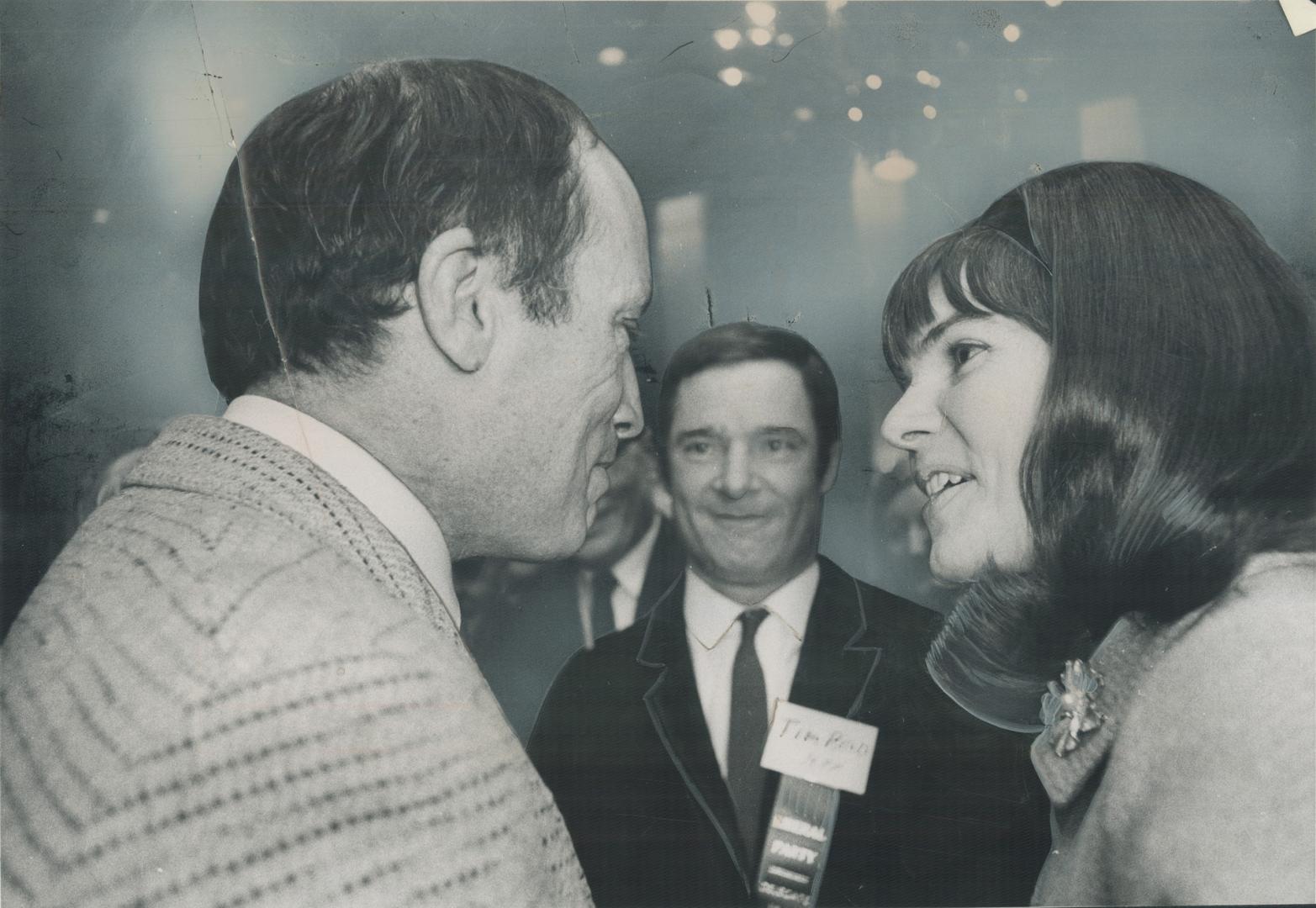 One of Many Women who shared the excitement of many of the 2,000 convention delegates leans forward eagerly to listen to Justice Minister Pierre Ellio(...)