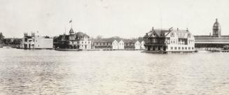 Image shows a lake view with some waterfront buildings in the background.