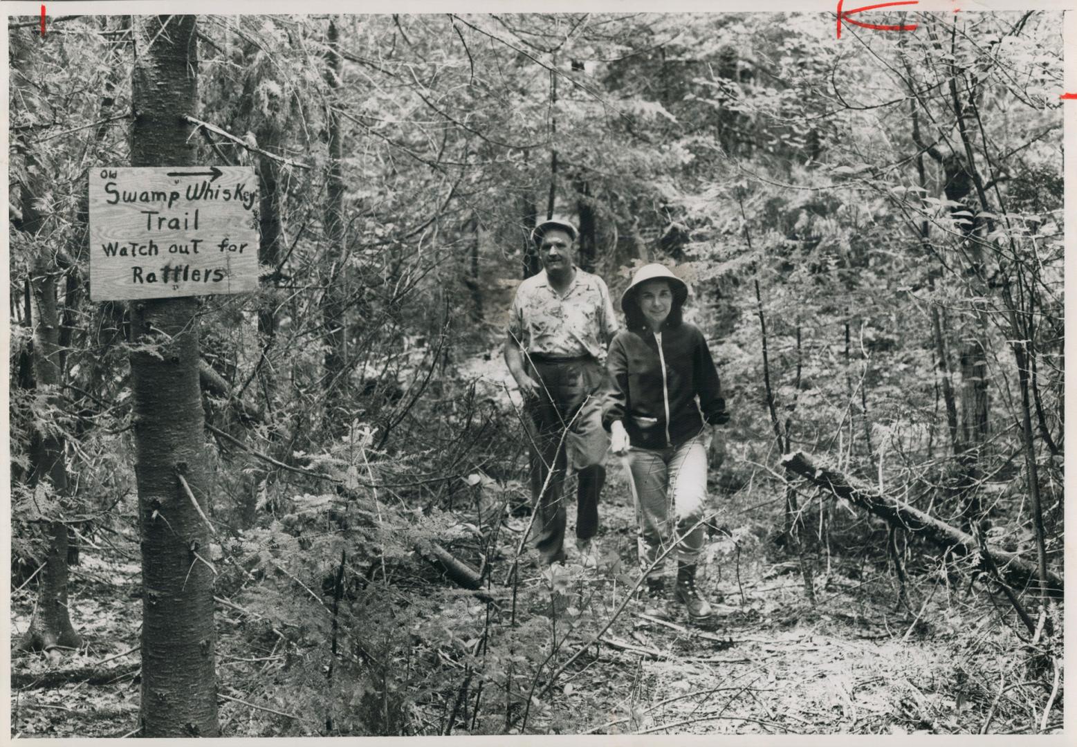 On the path to Whiskey Smoke Cave are Dot O'Neil and Star boating editor Stan Davies