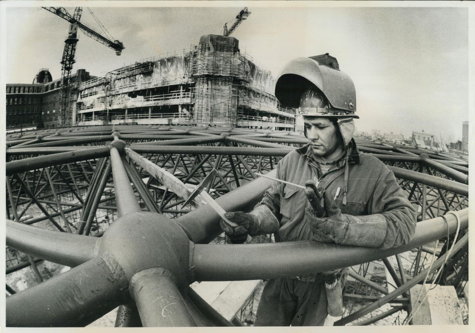 Robert McComber from Caughnawaga Indian Reservoir Montreal working on high steel constructions site in downtown Montreal as welder