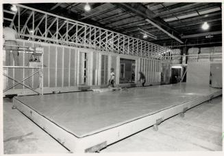 Ready-made: Finished sections wait outside (above) while walls undergo construction inside the Wingham factory of Royal Homes