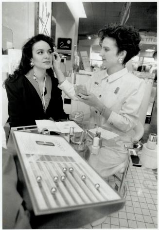 Wedding belles: Clinique consultant Amy Croutch, right, helps a client choose makeup colors for her wedding day