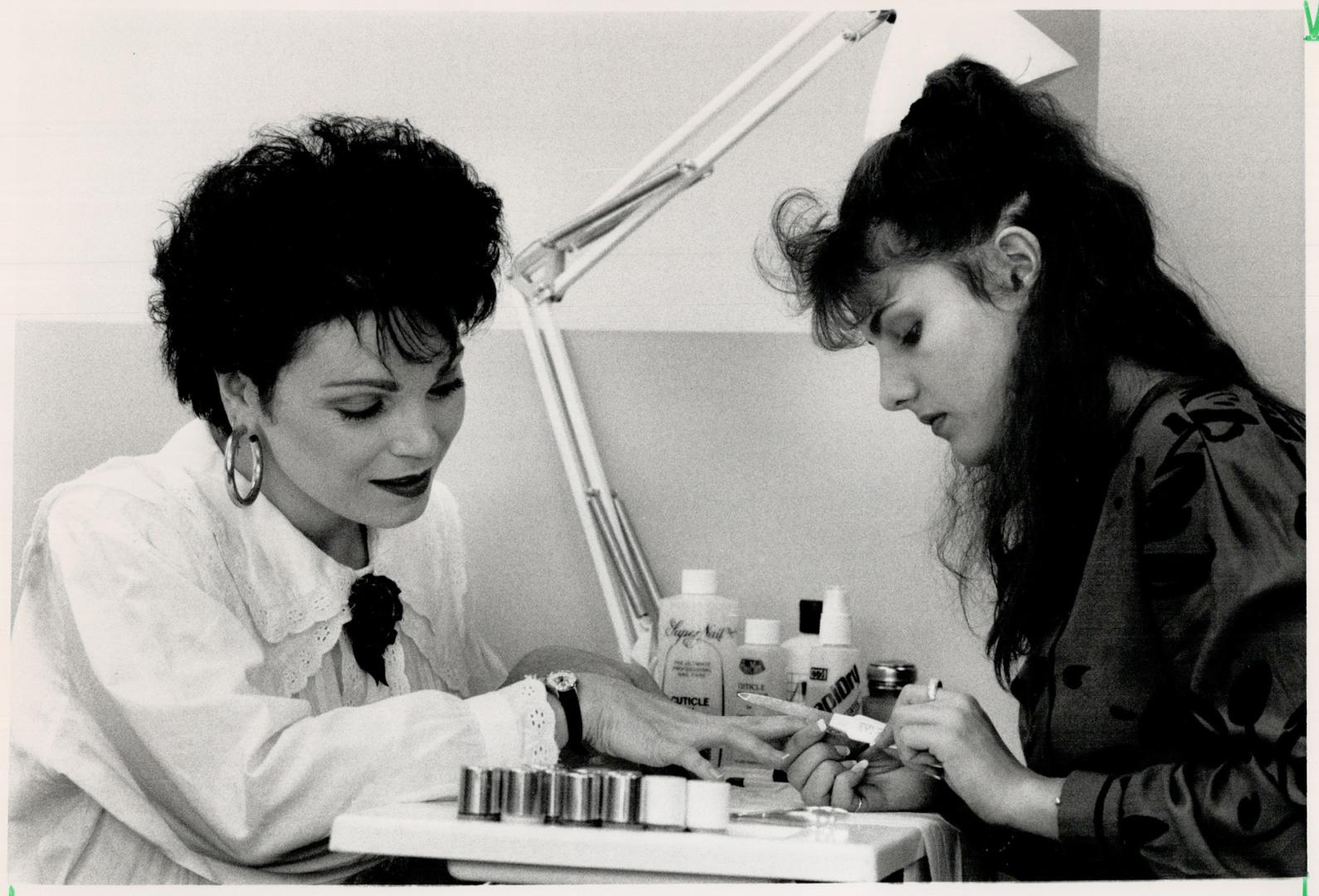 Hand care: Singer Patti Jannetta, left, gets her nails taken care of by technician Raylene Ross at Kathryn Kates Beauty Experience in Oakville