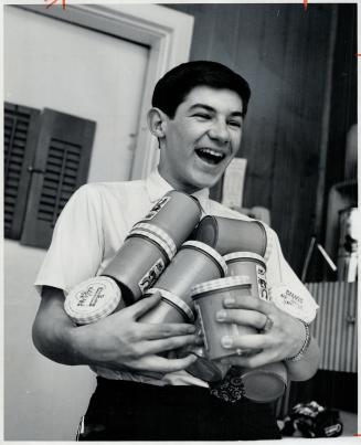 Michael holds 10 jars of Peanut Butter, a Special Mrs