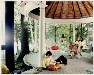 Molly Anderson, left, and Pat Lucas enjoy the breezes in a gazeboLucas' traditional Bala cottage