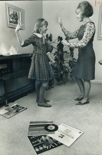 Which one is dancing the mashed potato? Valerie and Karyn Teresko, who were born deaf, are Beatle fans