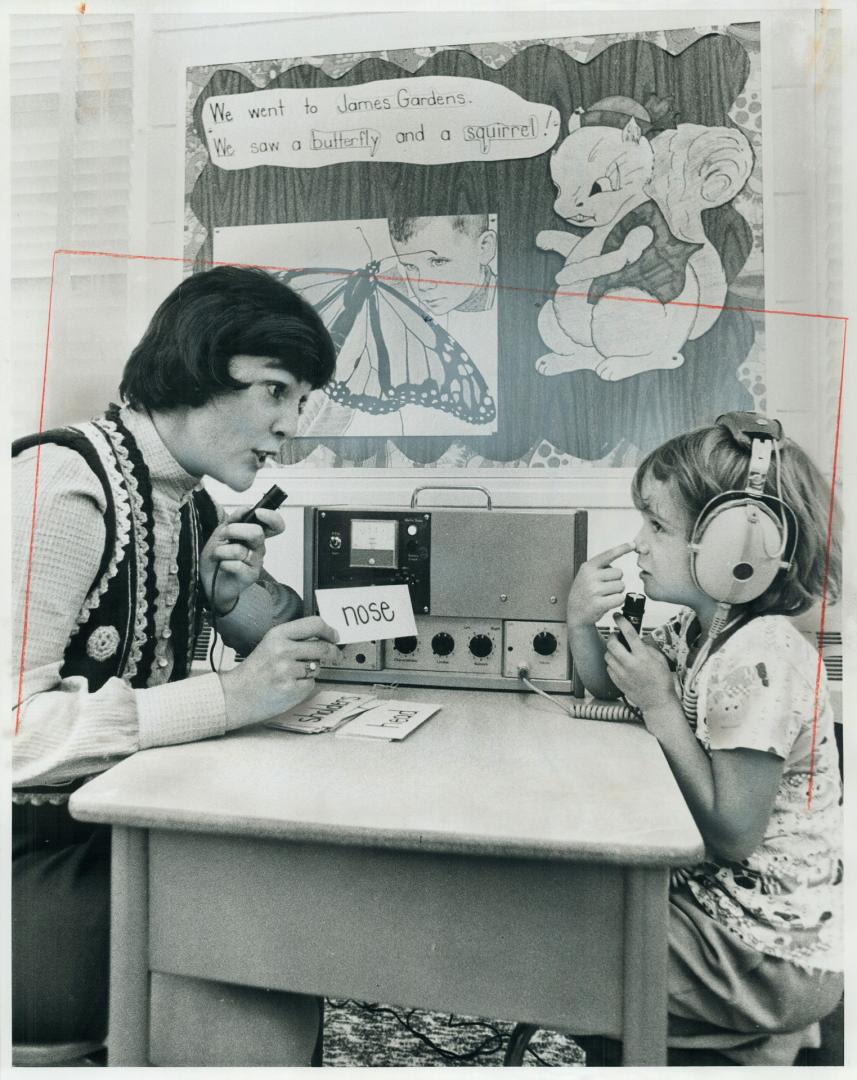 Deaf children are enrolled in a program at Buttonwood Hill Junior School in Etobicoke, where Barbara Misener teaches Kim Landry, 6, using the special (...)