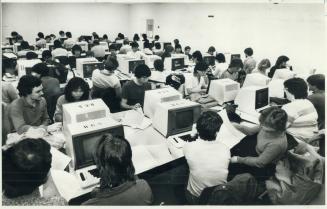 At the University of Waterloo's computer science centre (below) students learn on video-display terminals