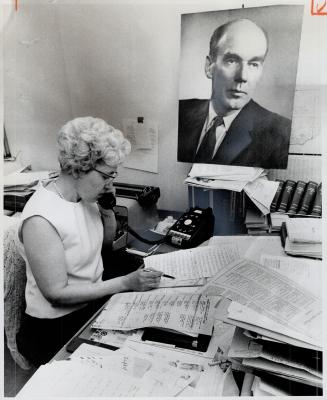 Campaign headquarters in Toronto for the major parties were bustling yesterday after announcement of the June 25 election date. At left, in Progressive Conservative offic,e Ontario secretary