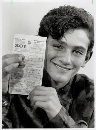 Early vote: Thirteen-year-old Blayne Creed snows the voter registration form he got in the mail