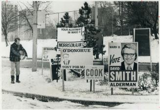 Snow job at election time. Before going to work at Douglas Aircraft, James Feruson scatters salt on the sidewalk at Oriole Parkway and Kilbarry Rd. to(...)