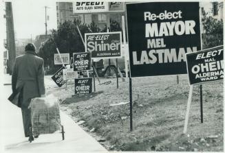 Forest of signs, above, from last municipal election: Reader suggests new system to eliminate all signs