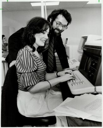 Way to go: Melanie Scarr is learning now to operate a video display terminal (VDT) under the eye of Allan Ebedes, director to the Toronto School Business