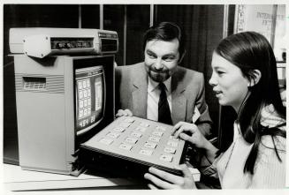 Making life easier: Karl Ullman and Margaret van Poelgeest of A and D Informatics Software demonstrate computer keyboard, program and voice synthesizer, designed especially for handicapped