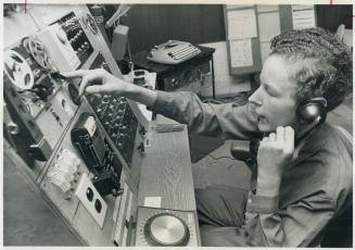 Electronics whiz kid Paul Styles, 14, sits at the master control panel in his Laurentide Dr home