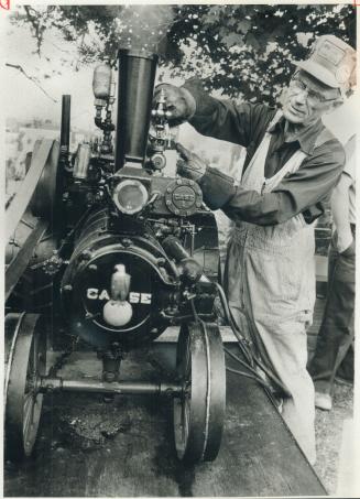 Ed Cooper, 71, and his model 1915 tractor