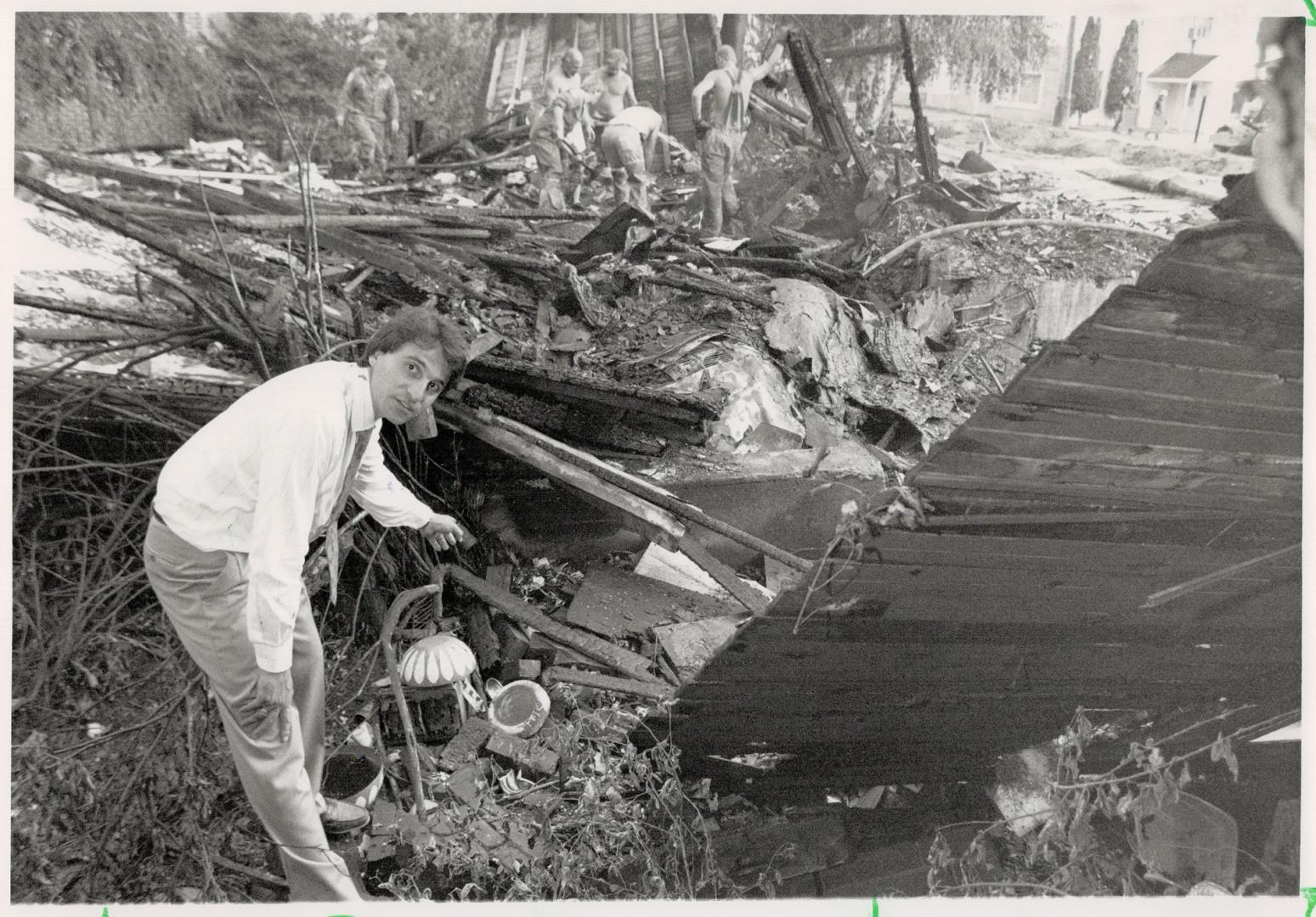 Gas blast: Rick Russo shows where Shelley Marks, 18, was buried after the Schomberg house she was in exploded yesterday