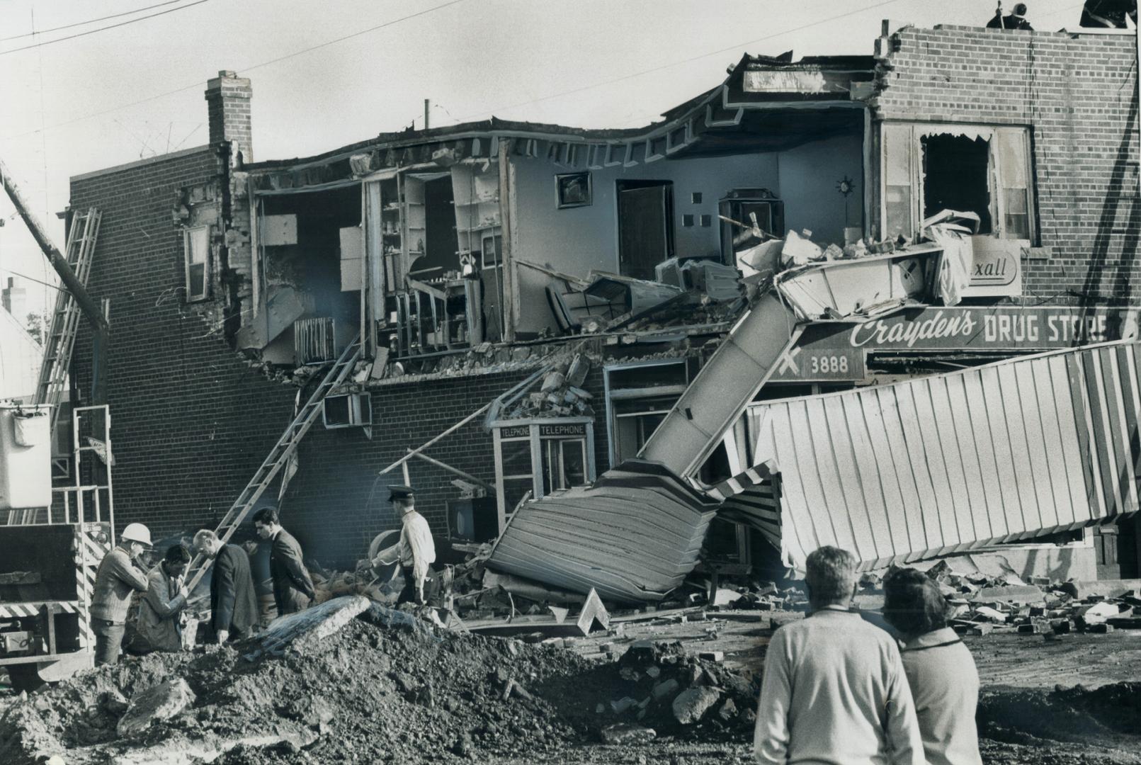 Violent Gas Explosion today blew out this 35-foot by 10-foot section of the brick apartment wall above Crayden's Pharmacy on Bloor St., in Etobicoke, (...)