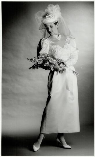 Right, ivory satin gown, $360, hat, $100, Eaton's Bridal Salon, Eaton Centre