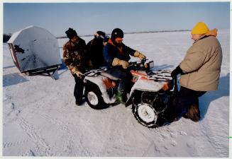 The Great Lake Simcoe Ice Fishing Derby started its 11th season Saturday and fish hut operators Terry reddings (left), Murray Tuck (riding the all-ter(...)