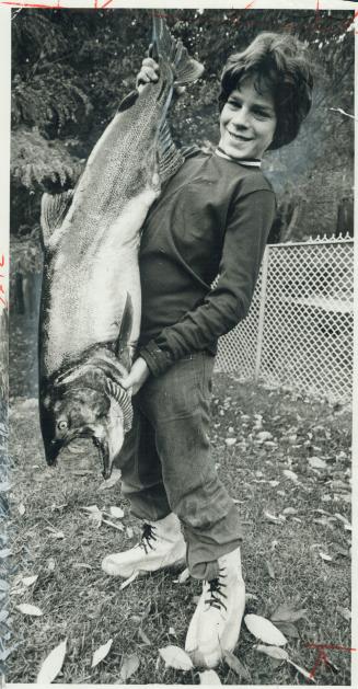 Fish tale. Tommy Phillips, 12, of East York, who tips the scales at 76 pounds, was fishing with his dad, Ralph, yesterday at Duffins Creek when he hoo(...)