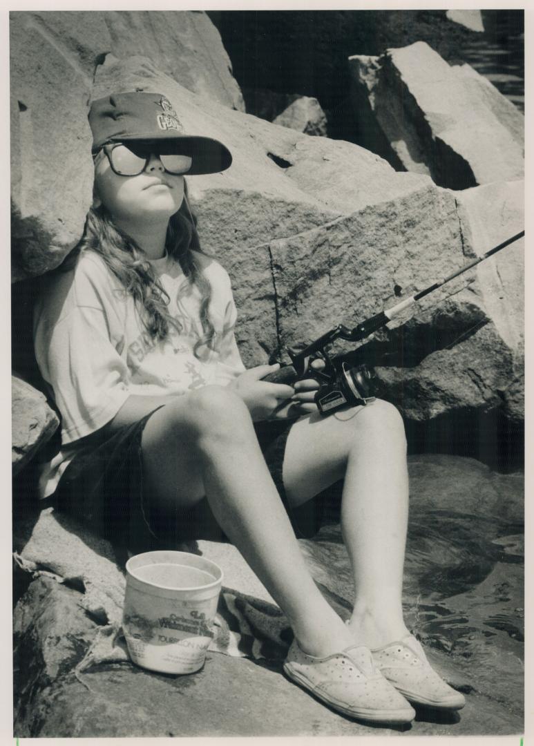 Summer fun. Kelly Legge, 9, starts summer off yesterday by reeling in the sun near the Lesile St. Spit. Today's forecast calls for more sun with thund(...)