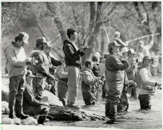 Fishermen, left, try their luck at Beaver River in Thornbury