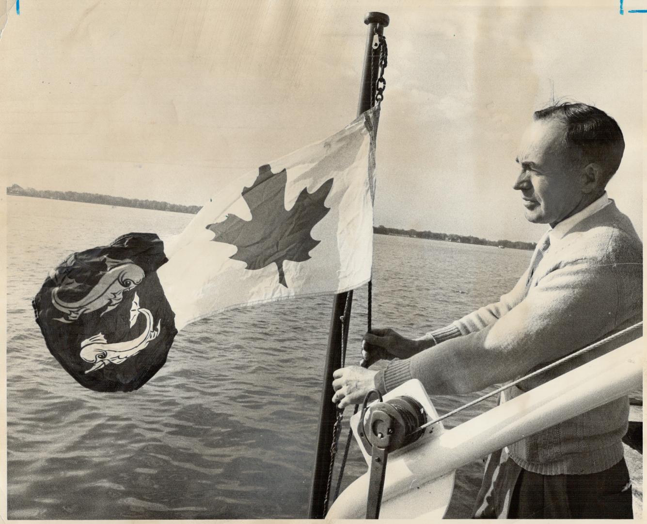 Canadian coast guard flag is raised on cutter Spume by Capt