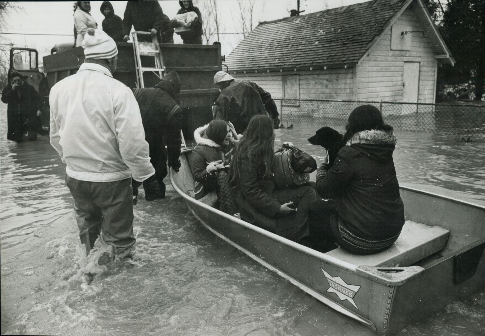 Residents leave for higher ground, More than 85 familys on one street alone had to fle their homes in the wake fo flood waters from Lake St. Clair