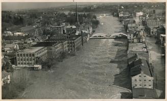 Rising 17 feet above its normal depth, the Grand river is shown here at Galt