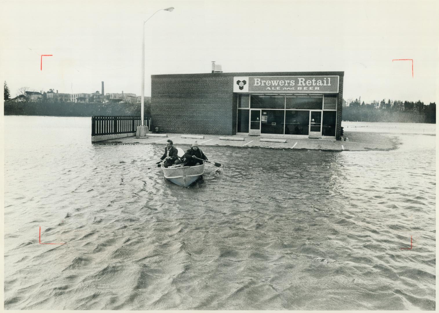 There's no stopping 2 men with a thirst, Flood waters from the rain-swollen Nith River overflowed into New Hamburg Saturday, leaving the Brewers Retail store on a small island-but still open