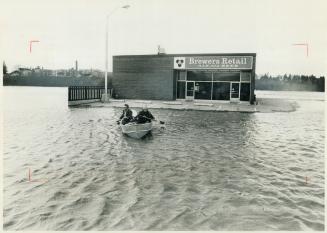 There's no stopping 2 men with a thirst, Flood waters from the rain-swollen Nith River overflowed into New Hamburg Saturday, leaving the Brewers Retail store on a small island-but still open