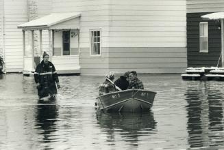 Volunteer firefighters use boat to check homes