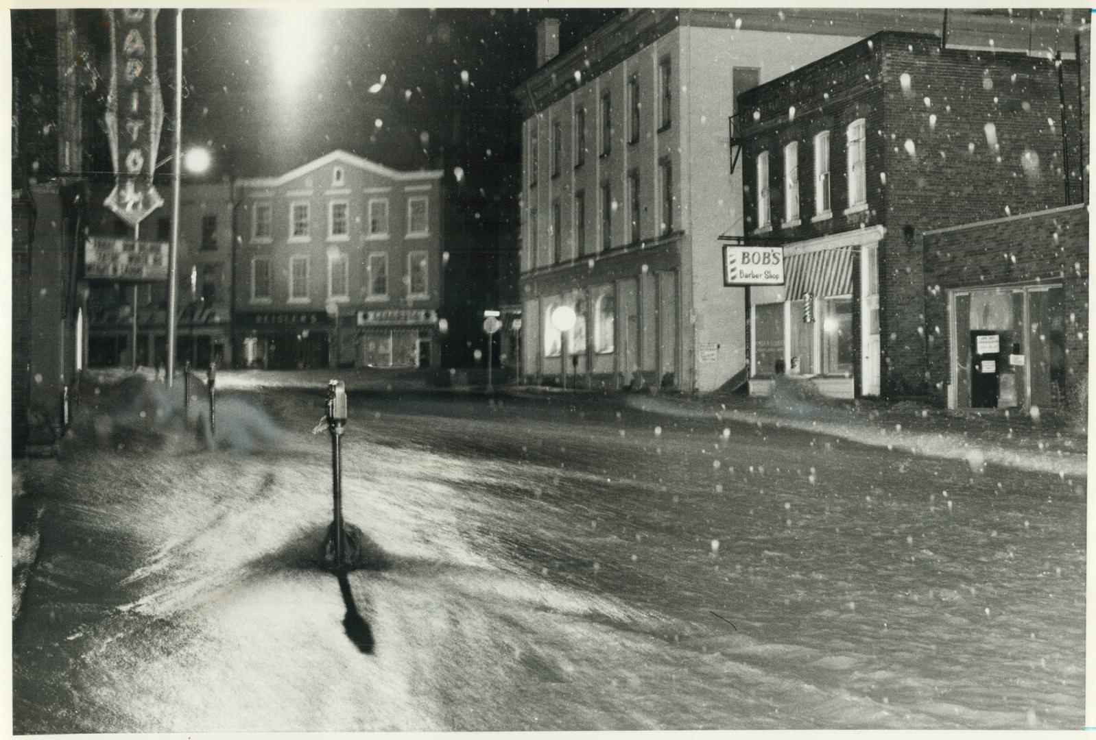 Raging torrent: Ganaraska River roars through downtown Port Hope in worst floods to hit the town in memory last night