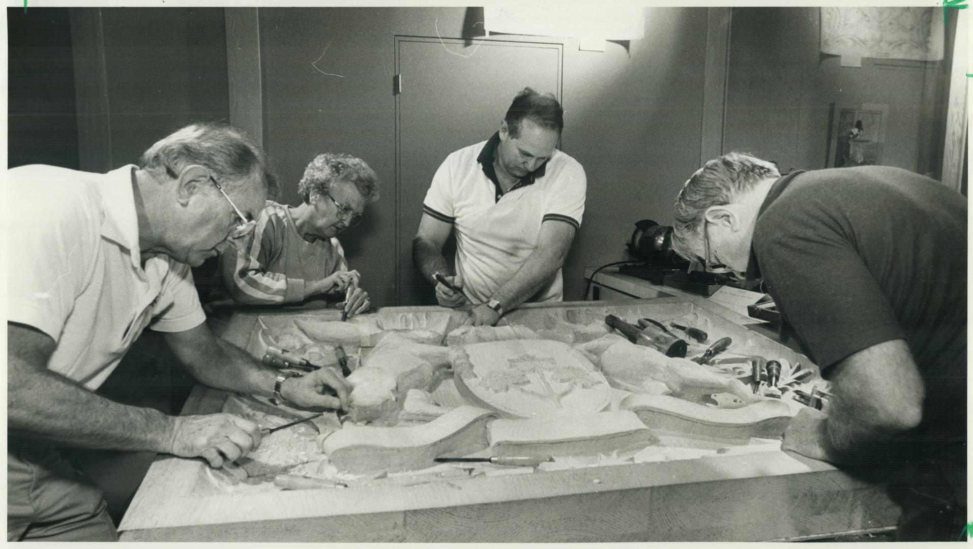 White pine Ontario coat-of-arms for Queen's Park, Members of the Ontario Woodcarvers Association, from left, Sandy Murray, Irene Davis, Ken Garnett an(...)