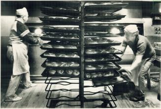 Making all kinds of dough. Mike Paczek, left, and Stanley Nasladka are night bakers at the Future Bakery on Queen St. W., where they have worked for 2(...)