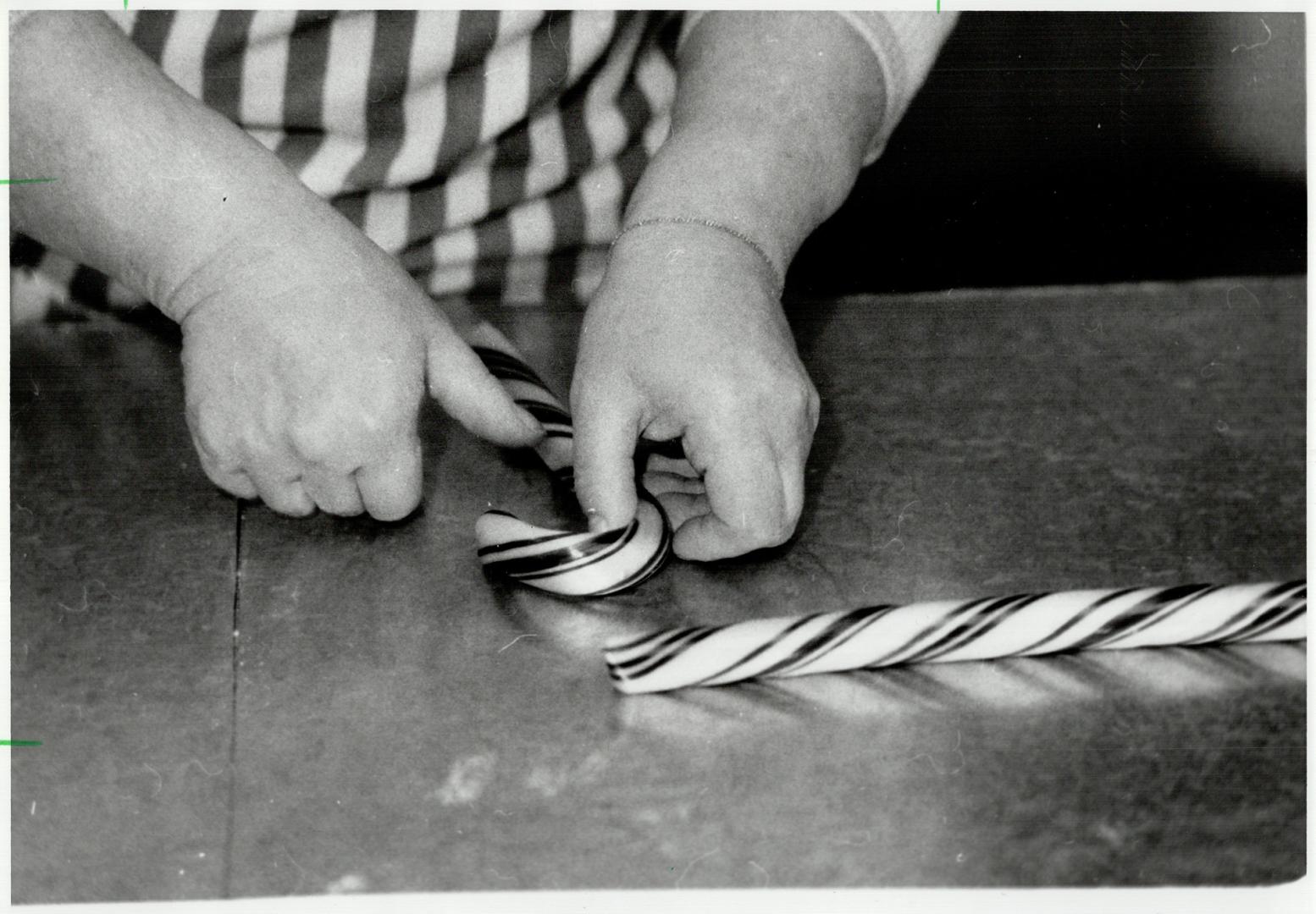 Hook it: Lastly, the candy canes are shaped and hooked so they can hang on Christmas trees for eager children to snare when parents aren't looking