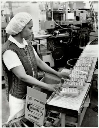 Gum line: Aileen Deane boxes Chiclets rolling off a conveyor belt