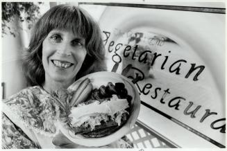 Veggie delight. Penny Cassel of Soy City Foods shows off her Tempeh Reuben sandwich. Tempeh is an Asian food prepared by fermenting soybeans