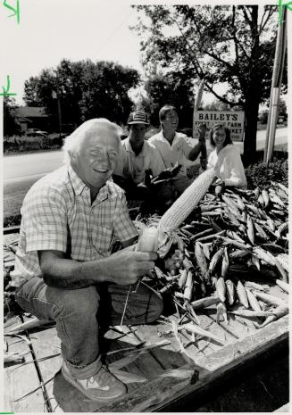 Oh, Shucks! Grant Bailey appreciates the help of his children when the corn's ready