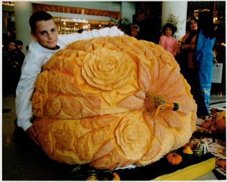 Stephen Webber, 12, shows off his pumpkin at Queen's Quay Terminal yesterday