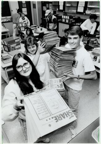 Helping hands: Thornlea Secondary students Lisa Steinman, front, Andrea Rose and Phil Somer hold some of the 120,000 bags ready for food drive