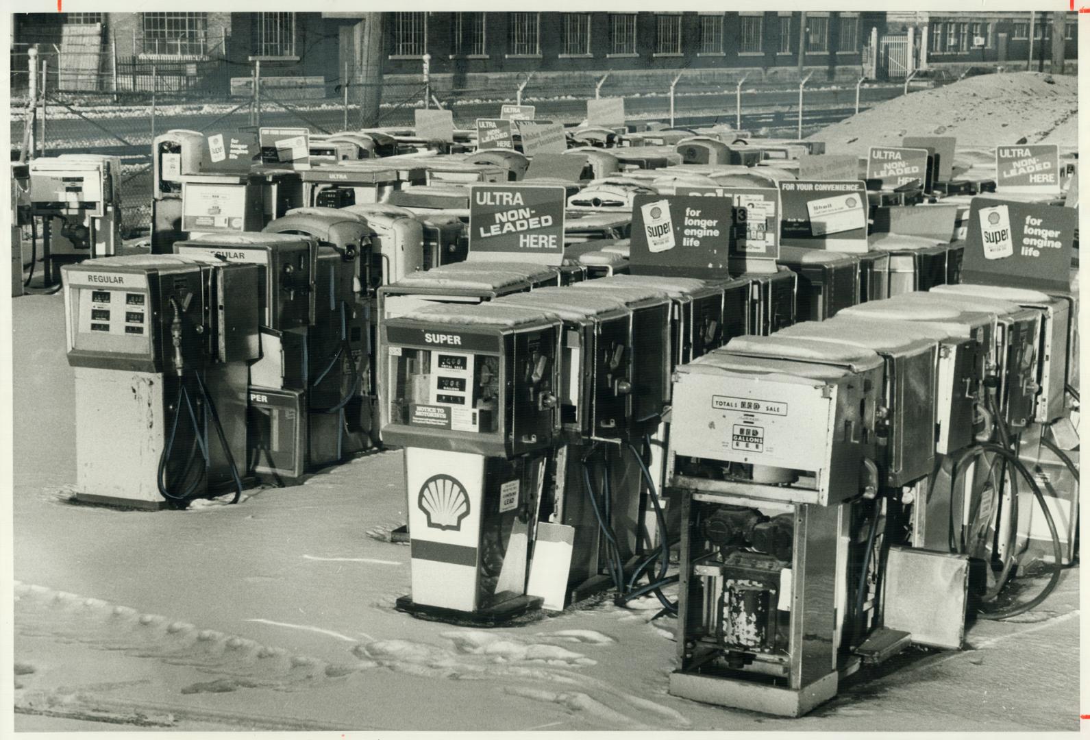 Graveyard of gas pumps and old-fashioned prices, Cherry St