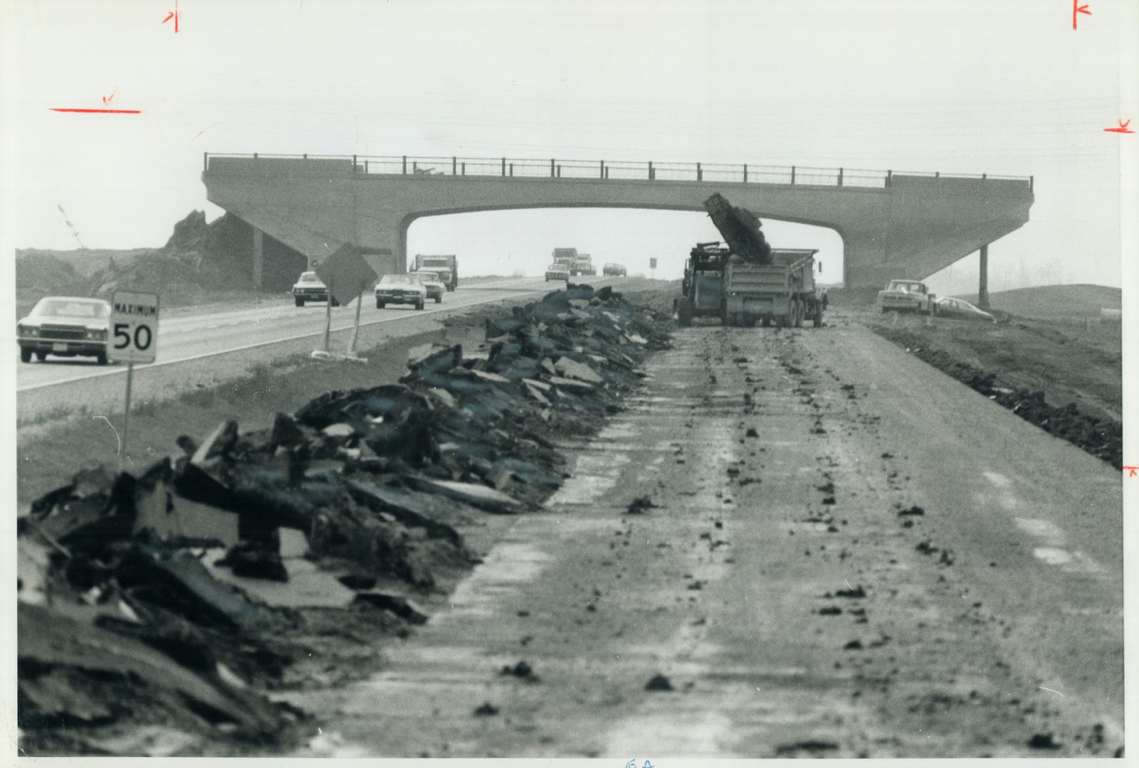 A bridge to nowhere spans Highway 401 west of Dixie Rd